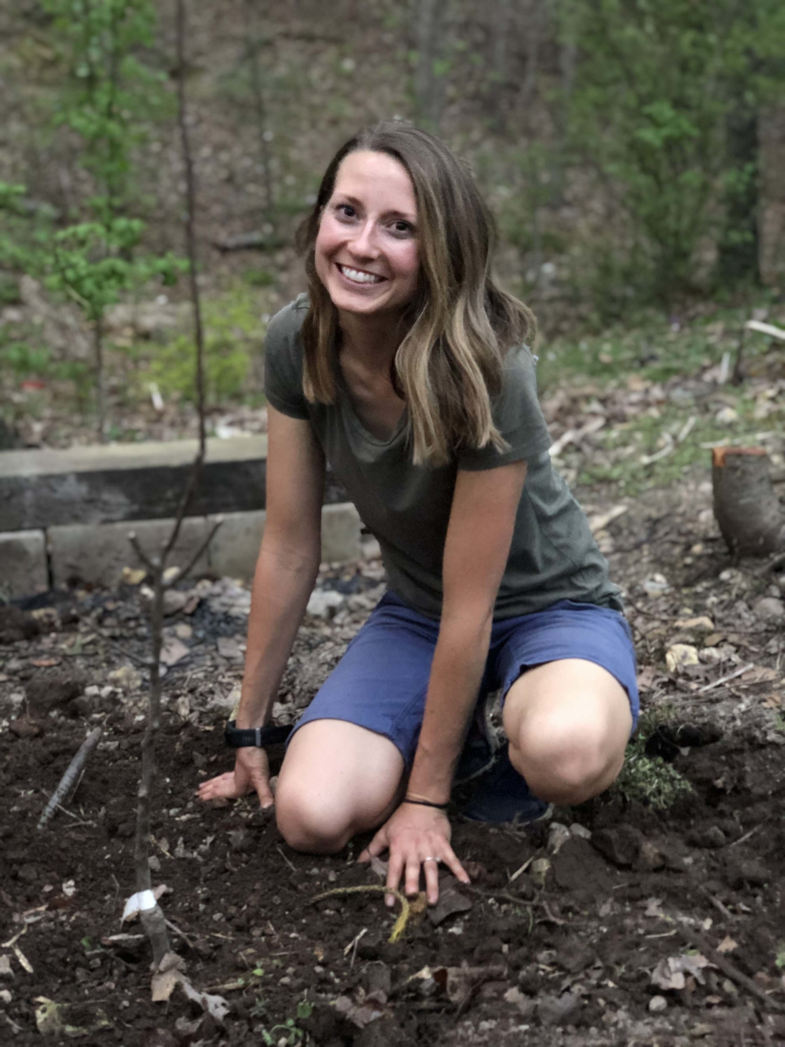  Planting the new pear tree. This was suppose to be more focused on the tree but This I get when Cameron takes the picture :) 